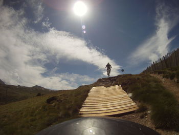 Man on mountain against sky