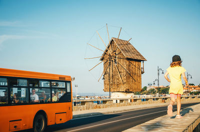 Side view of cropped bus on road