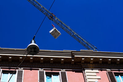 Low angle view of building against clear blue sky