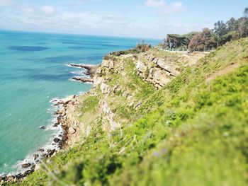 High angle view of sea shore against sky