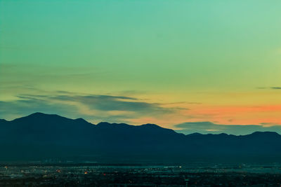 Scenic view of mountains at sunset