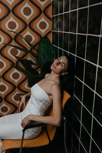 High angle view of young woman standing in cage