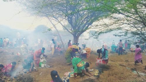 People on field at village