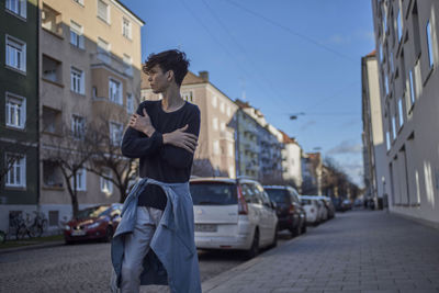 Man in city against clear sky