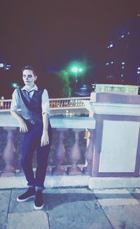 Full length of woman standing at night