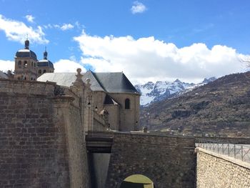 Houses against mountain range