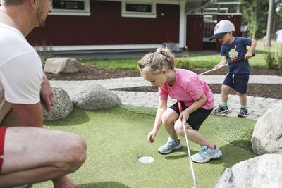 Children playing mini golf