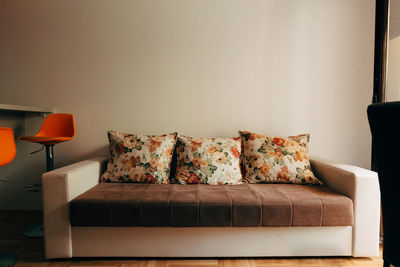 Empty sofa on table against wall at home