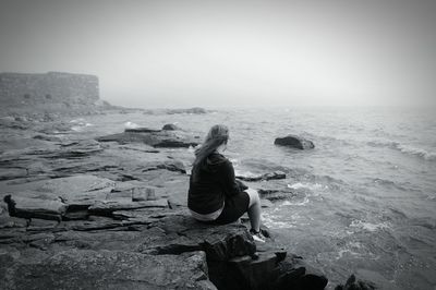 Full length of woman on beach against sky