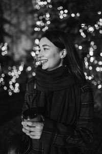 Happy woman at the christmas market at night