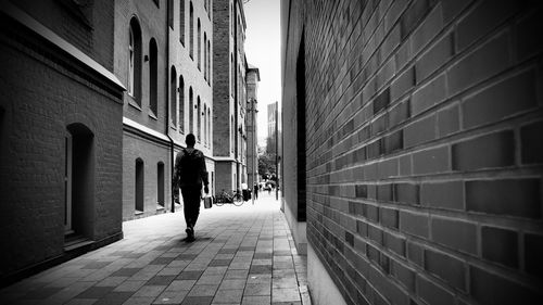 Rear view of man walking in city