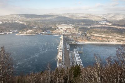 High angle view of dam and bridge against sky