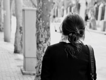 Rear view of woman walking outdoors