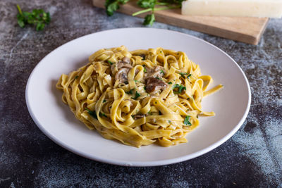 Italian fettuccine pasta with porcini mushrooms. italian pasta. vegetarian dish.