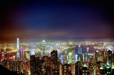 High angle shot of illuminated cityscape against sky