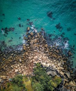 High angle view of rocks in sea