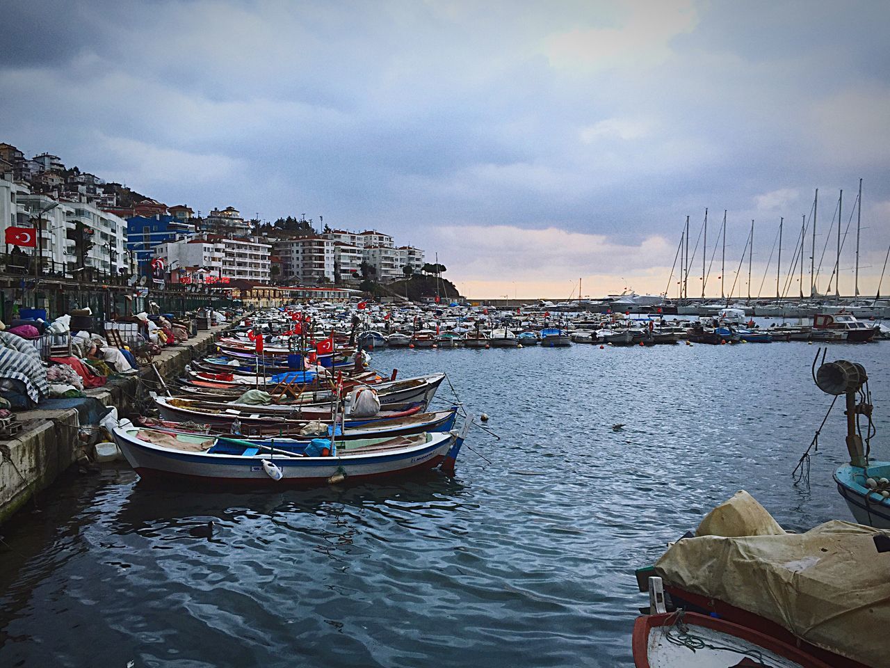 water, building exterior, nautical vessel, architecture, built structure, transportation, sky, mode of transport, boat, moored, waterfront, city, cloud - sky, river, harbor, sea, rippled, canal, outdoors, cloud