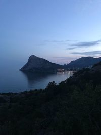 Scenic view of sea against sky at dusk