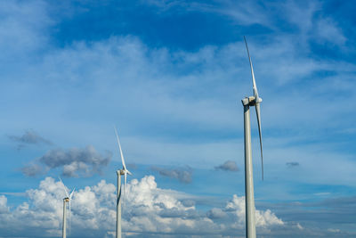 Low angle view of wind turbine against sky