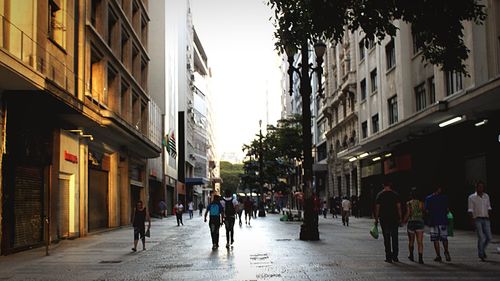 People walking on street in city