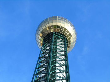 Low angle view of spiral building against clear blue sky