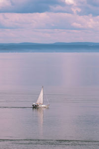 Little sailboat on the sea in a bay 