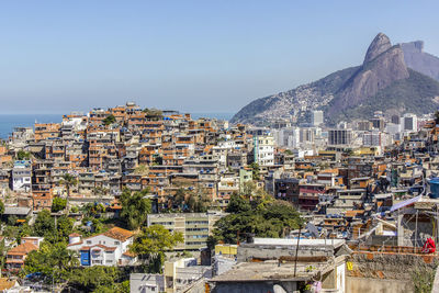 Buildings in town against clear sky