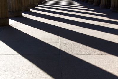 Shadow of sunlight falling on footpath