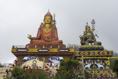 Low angle view of temple against building