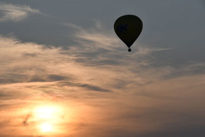 Low angle view of hot air balloon against sky during sunset
