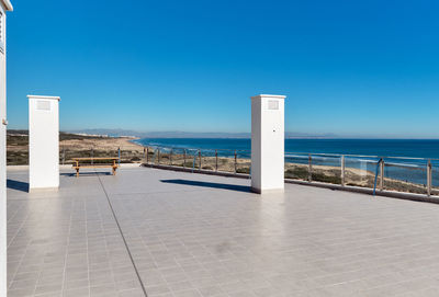 Scenic view of sea against clear blue sky