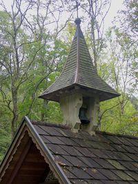 Low angle view of roof and building against sky