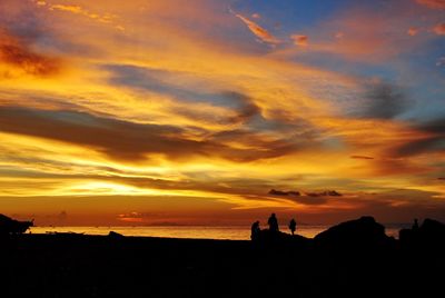 Scenic view of silhouette buildings against sky during sunset