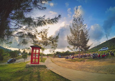 Lifeguard hut on field against sky