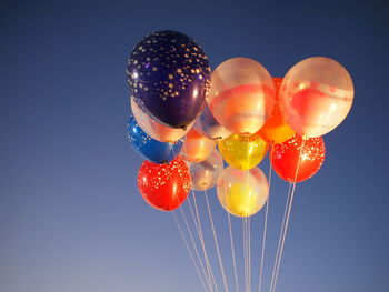 Low angle view of hot air balloon against clear sky