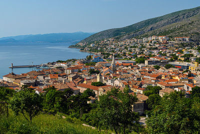 Senj, aerial view of townscape by sea against sky