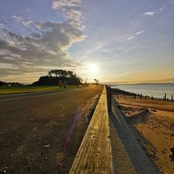 View of road against sky during sunset