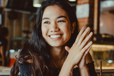 Close-up of smiling young woman