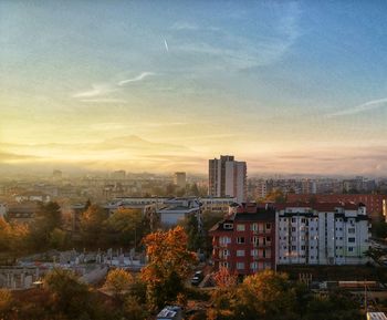 High angle view of buildings against sky during sunset