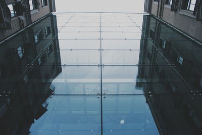 Building reflecting in water