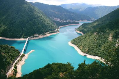 High angle view of river amidst mountains 