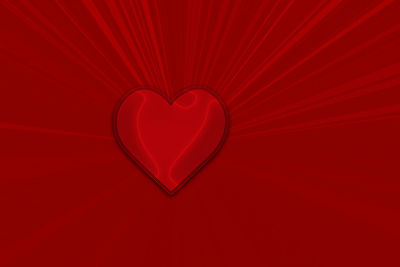 Close-up of heart shape over red background