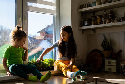 Woman and daughter at home