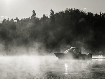 Scenic view of fishing boat in foggy weather