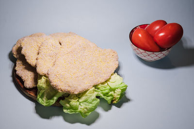 High angle view of tomatoes in plate on table