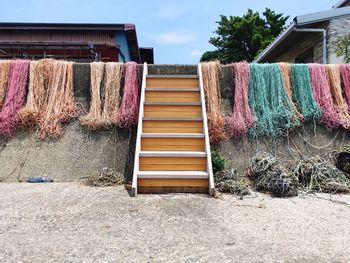 Clothes drying on clothesline against building