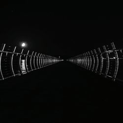 Illuminated bridge at night