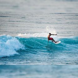 People surfing in sea