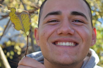 Close-up portrait of smiling mid adult man