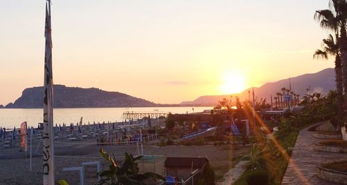 Panoramic view of beach against sky during sunset